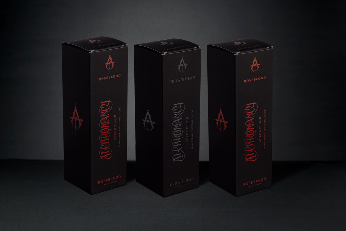 Two Roseblood House Editions with one Crow's Head between them.